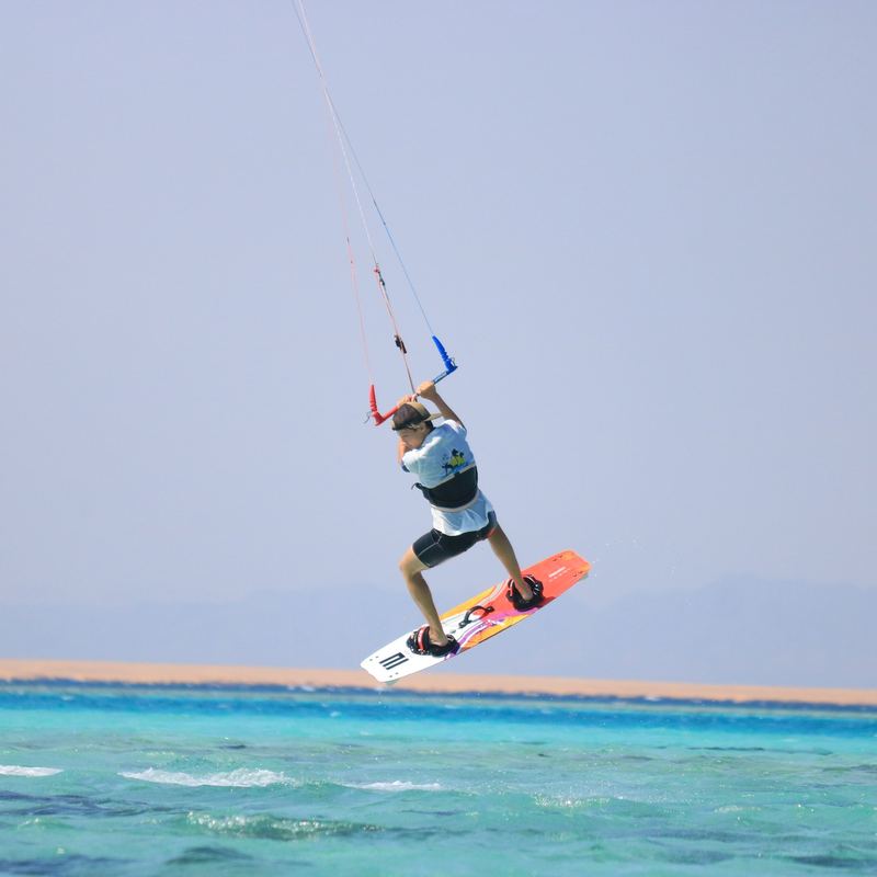 A jump over the lagoon by a sandy island