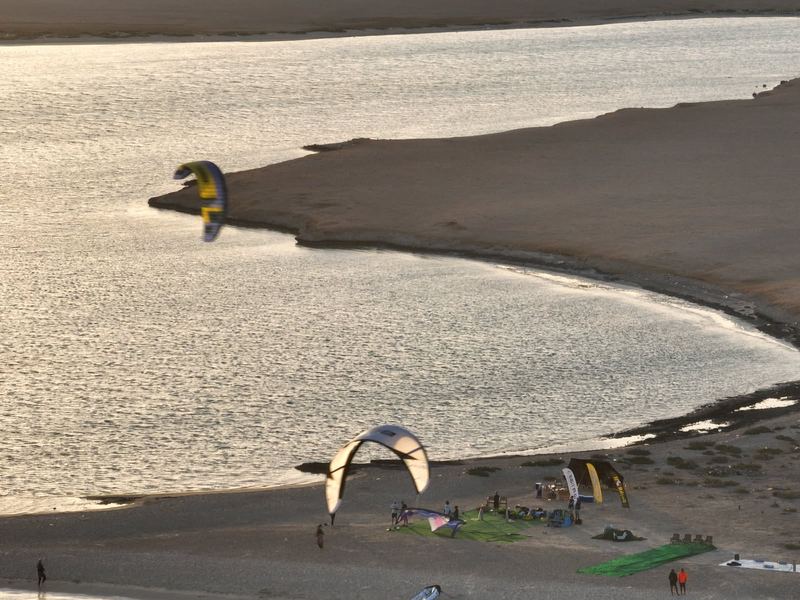 Kites on the shore of an island bay