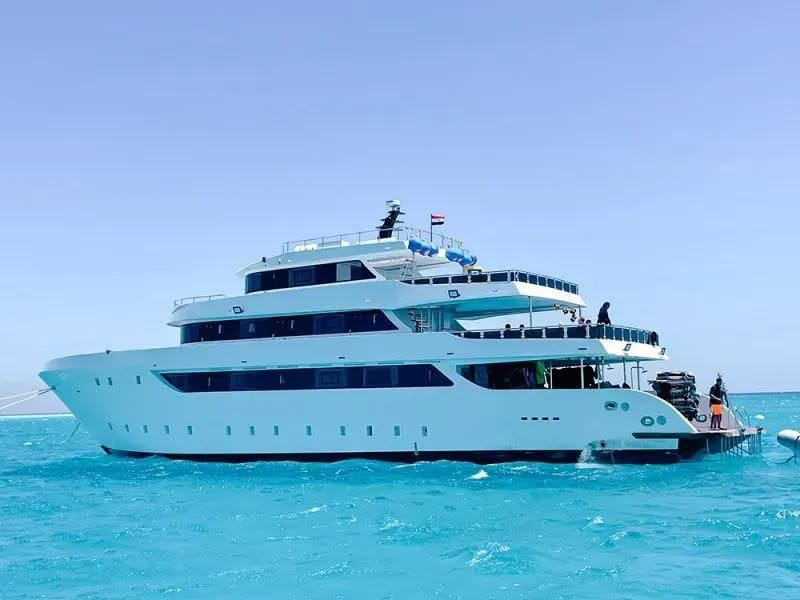 M/Y Hermes from the side, 3 decks above blue water